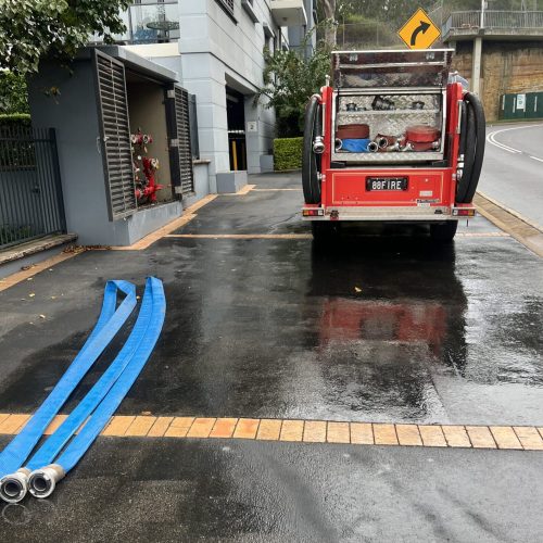 Fyrepower truck from the back and hose reels on the floor after performing hydrostatic pressure test